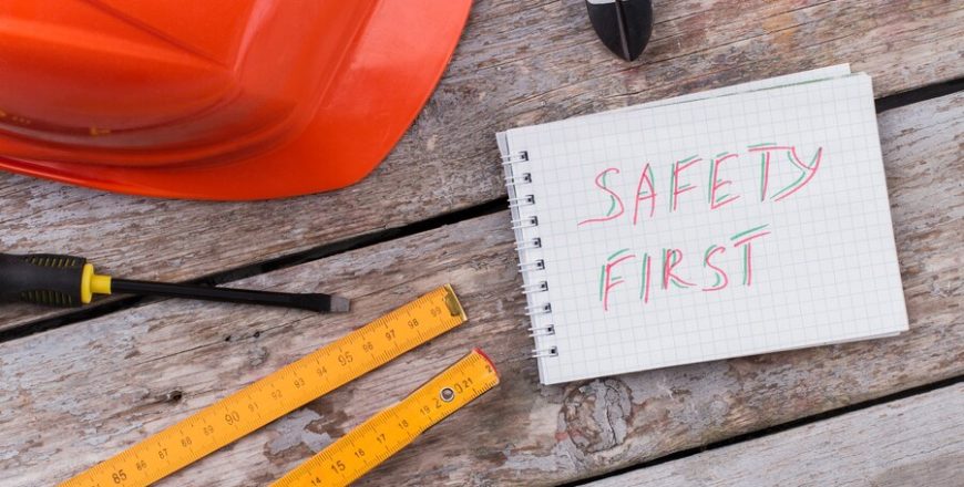 repairman-constructor-items-safety-first-notice-top-view-flat-lay-plastic-helmet-with-screwdriver-pliers_274234-3909-870x440